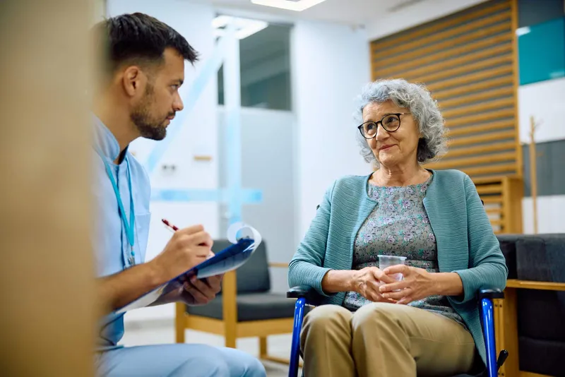 Healthcare worker and patient discuss health