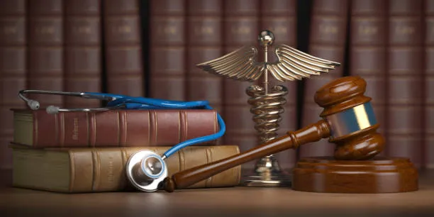 Gavel, stethoscope, and caduceus symbol