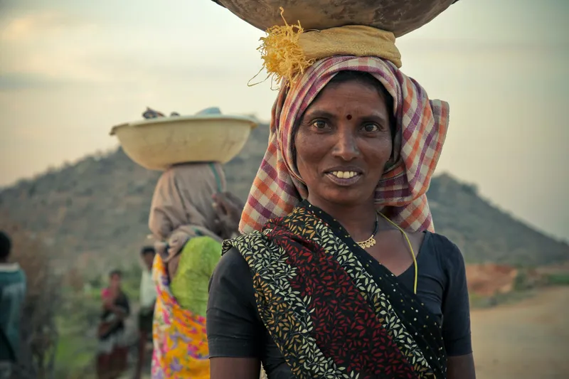 Rural Indian women carrying loads