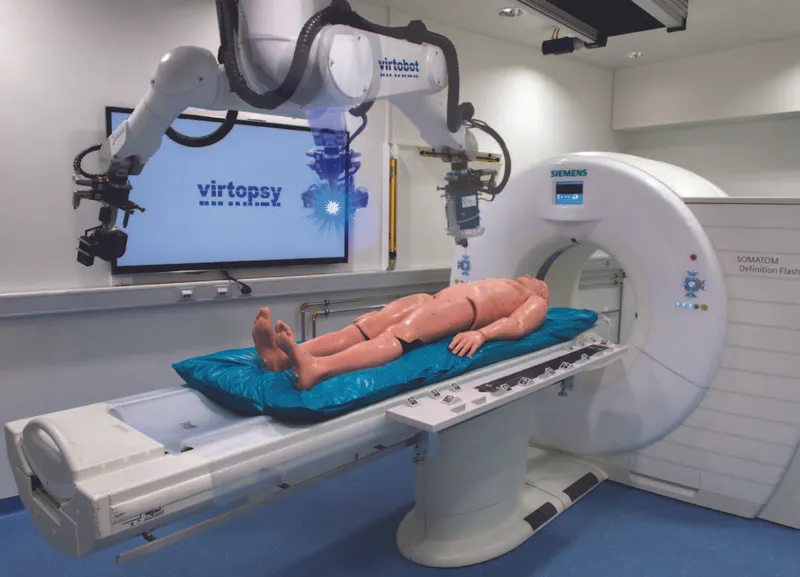 Virtopsy setup with CT scanner and robotic arm