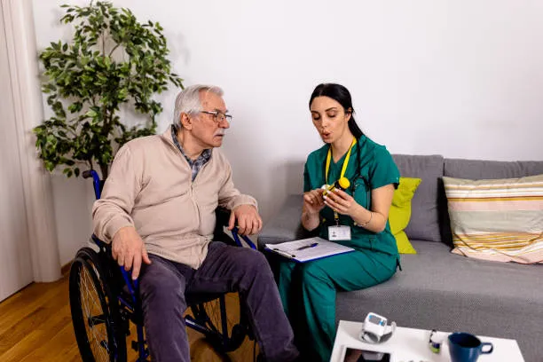 Nurse explains medication to elderly patient