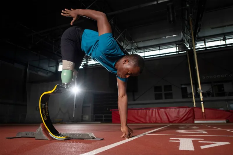 Athlete with running blade prosthesis