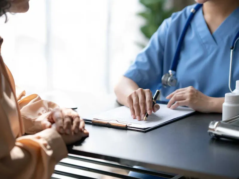 Doctor and patient with documentation