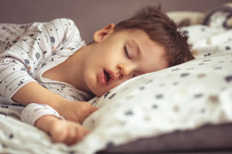 Child sleeping with mouth open