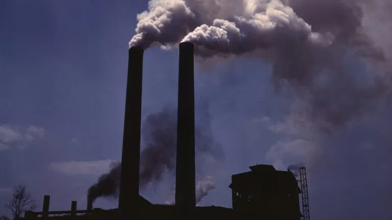 Industrial smokestacks polluting the air