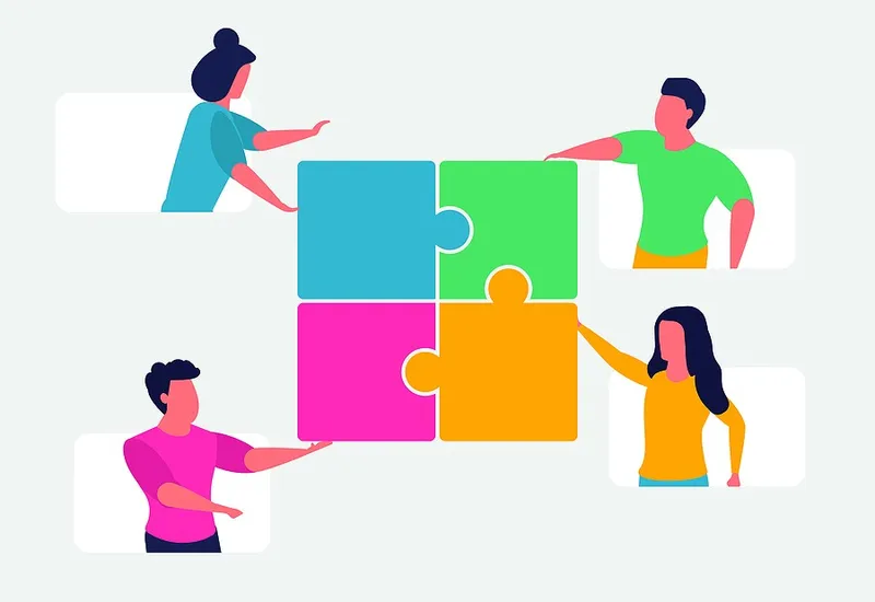 Multidisciplinary team working on a puzzle