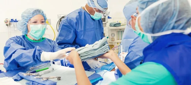 Surgical team in PPE and sterile field setup