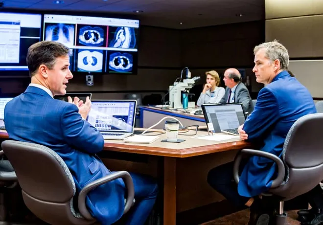 Multidisciplinary Tumor Board Discussing Patient Scans