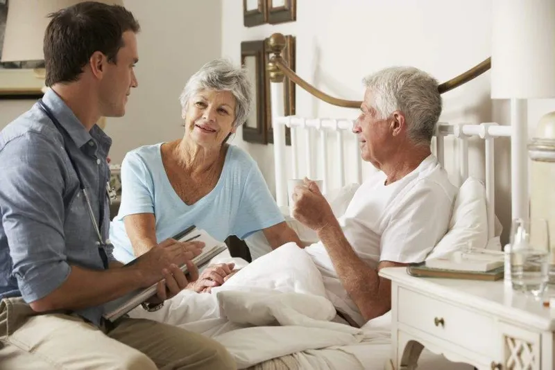 Peaceful hospice room with natural lighting and family presence