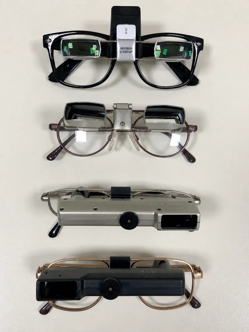 Spectacle-mounted low vision aids